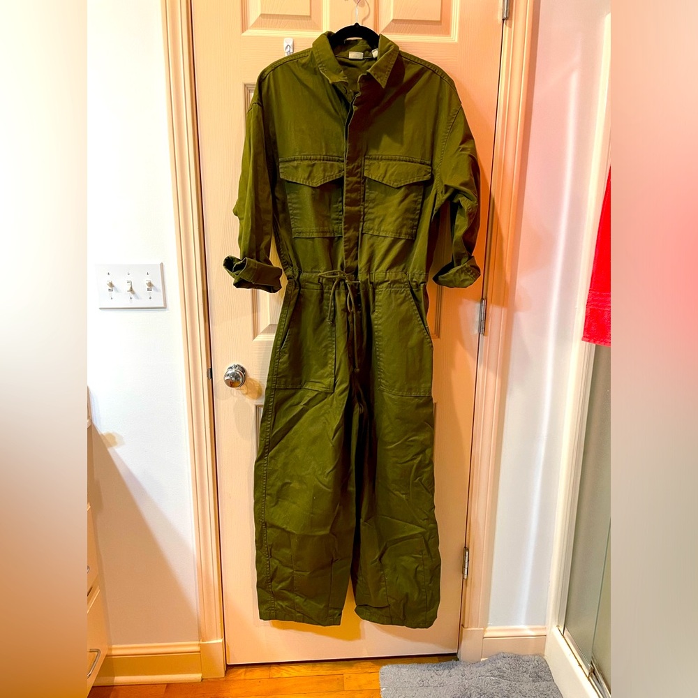 Levi’s coverall jumpsuit. Lots of pockets and draw stringwaist